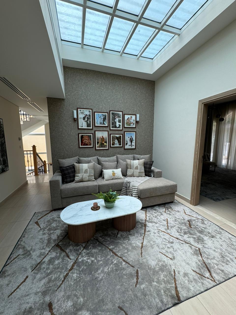 Double height living room sheer drapery